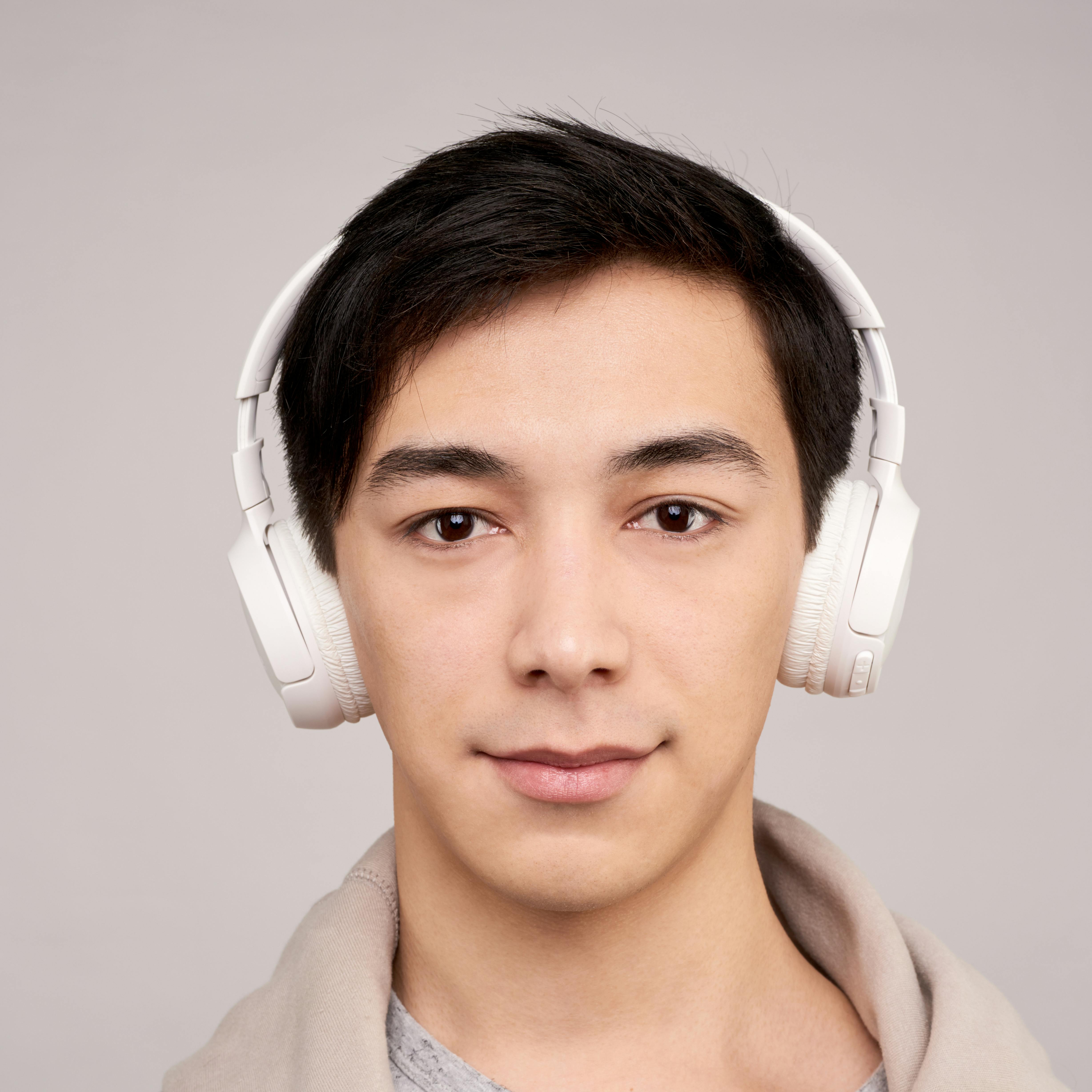 pexels-photo-3394657-3394657 Portrait of a young man wearing wireless headphones, enjoying music.